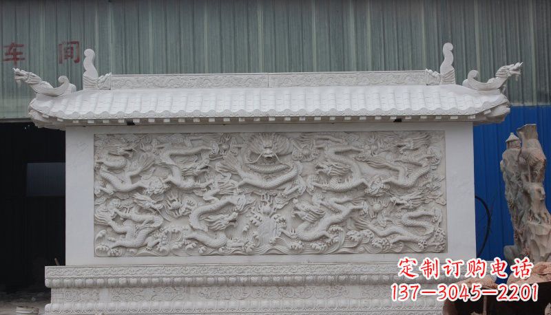 绵阳九龙壁石雕塑——让礼堂充满豪华气息